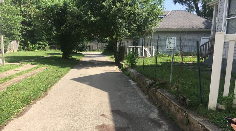 Middletown police said Kenneth Roesch, of Middletown, allegedly stabbed Carlton Brock, of Middletown, several times in the torso Friday night in this alley on Arlington Avenue. RICK McCRABB/STAFF