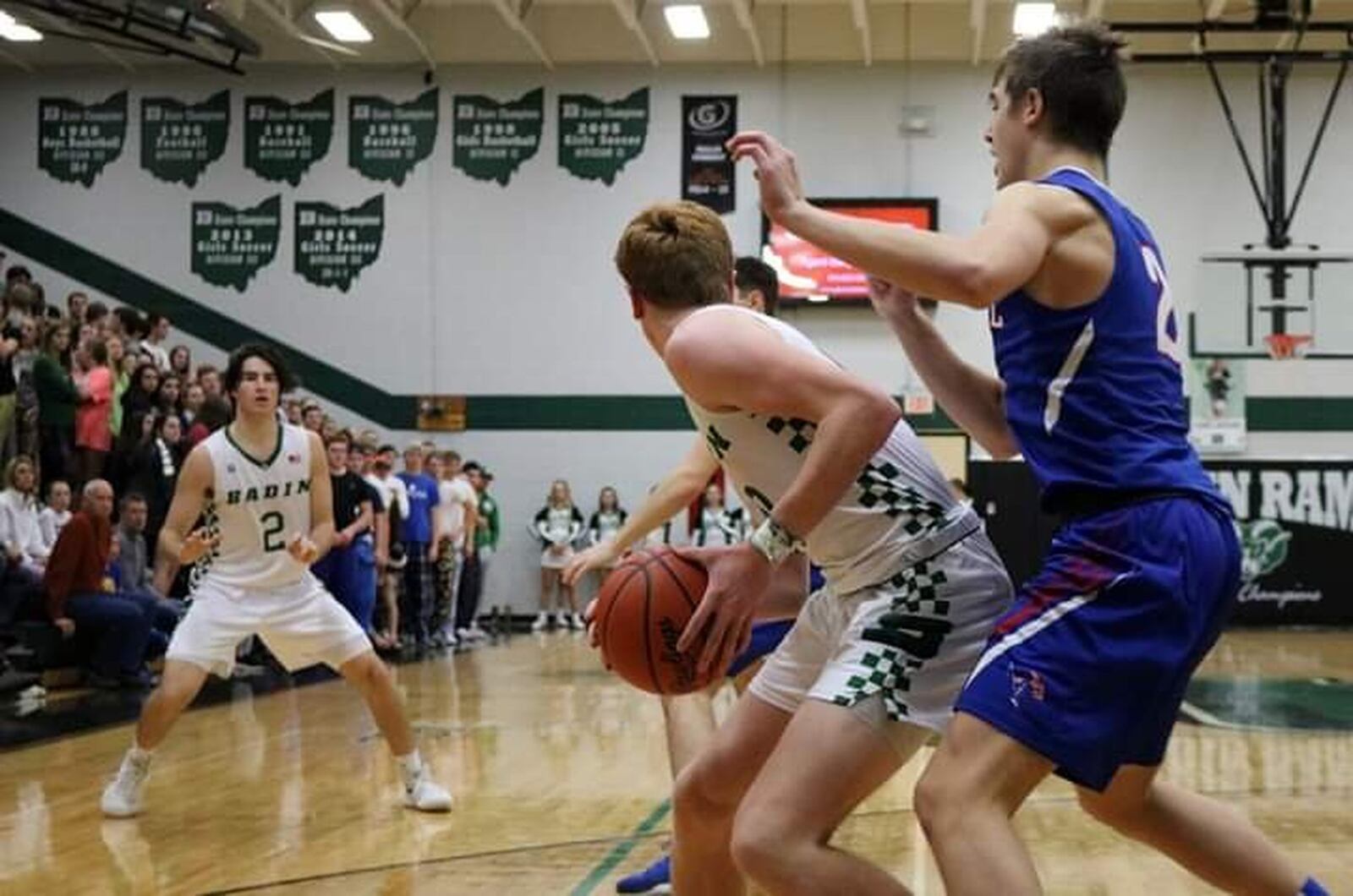 Badin’s Zach Switzer (with ball) looks toward teammate Seth Hargis as Carroll’s Jaden Dahm applies defensive pressure during Friday night’s game at Mulcahey Gym in Hamilton. Badin won 43-42. CONTRIBUTED PHOTO BY TERRI ADAMS