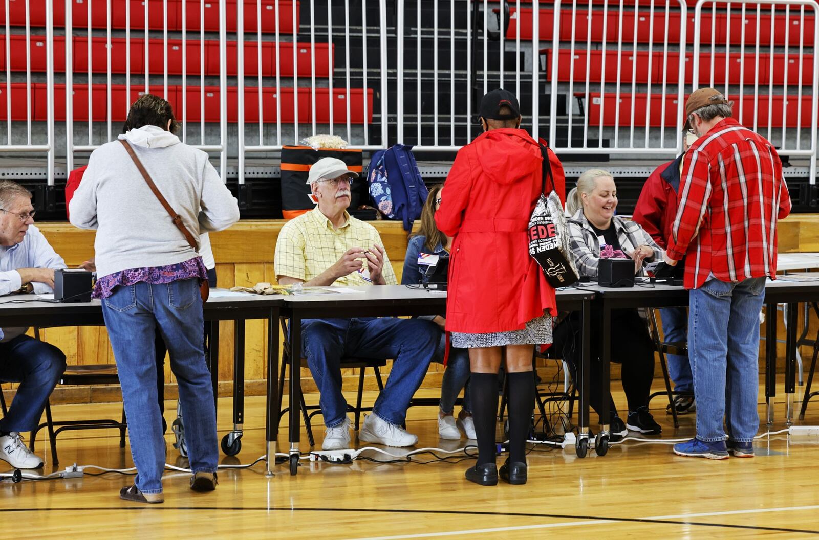 Butler County Board of Elections poll workers check in voters at Creekside Middle School Tuesday, May 3, 2022 in Fairfield. NICK GRAHAM/STAFF