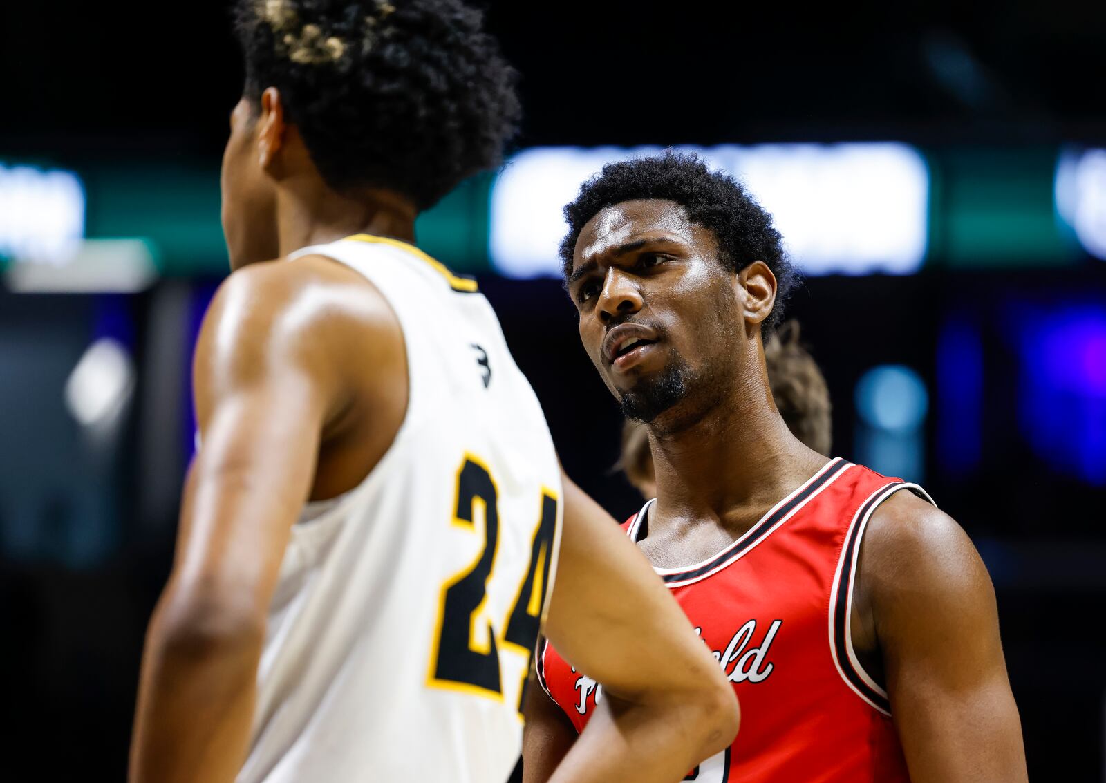 Centerville's Baboucarr Njie, left, and Fairfield's Mason King exchange words during their Division I regional final basketball game Saturday, March 11, 2023 at Xavier University's Cintas Center. Centerville won 64-53. NICK GRAHAM/STAFF