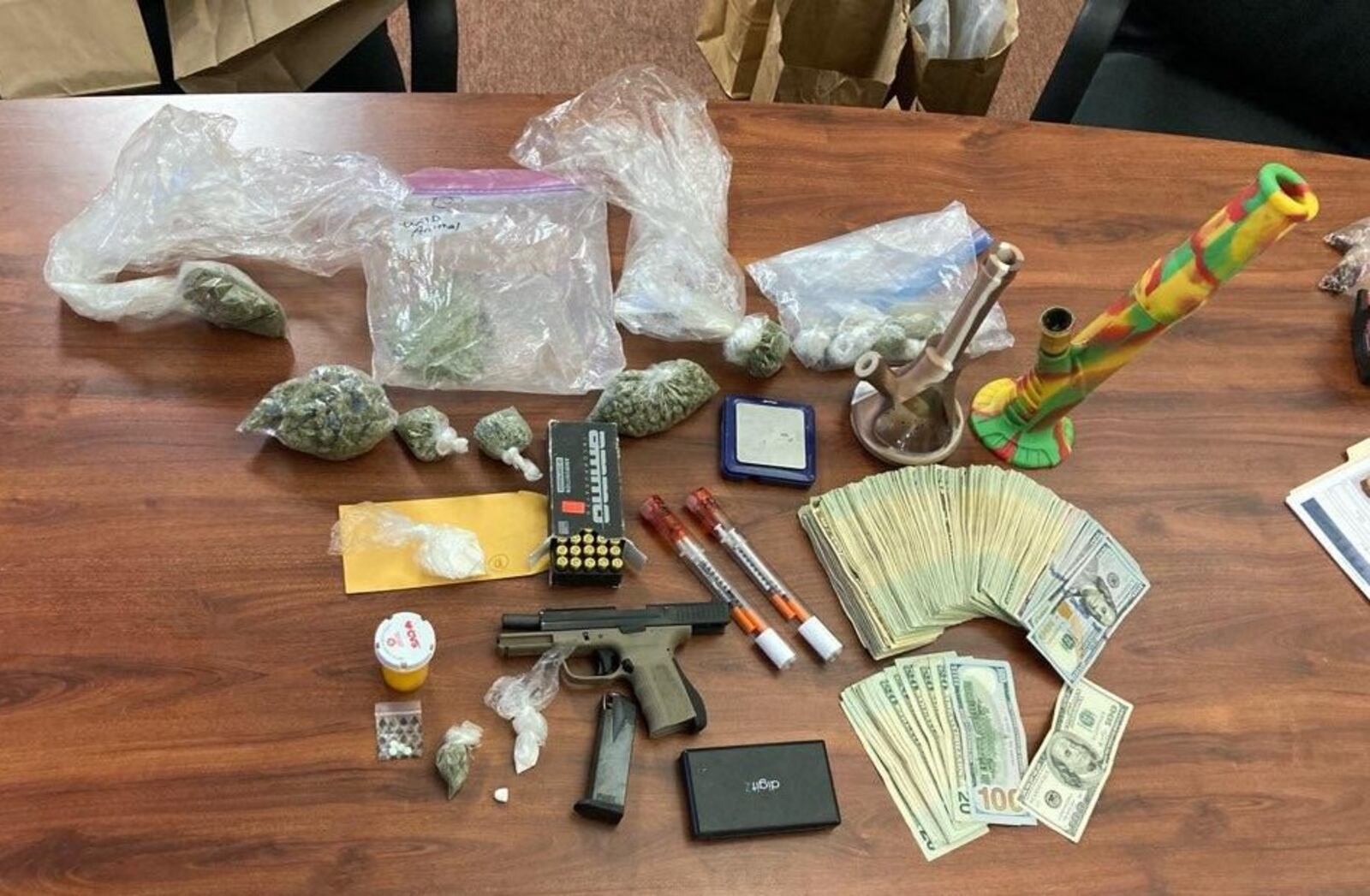 Drugs, money and a gun were confiscated Tuesday during a search warrant in Middletown. BUTLER COUNTY SHERIFF'S OFFICE