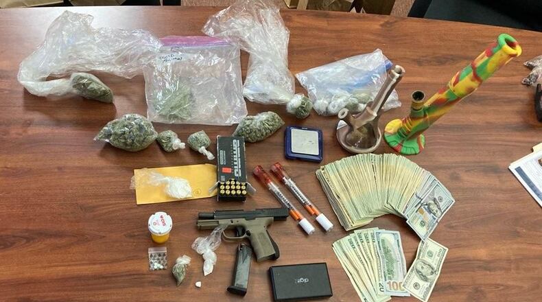 Drugs, money and a gun were confiscated Tuesday during a search warrant in Middletown. BUTLER COUNTY SHERIFF'S OFFICE