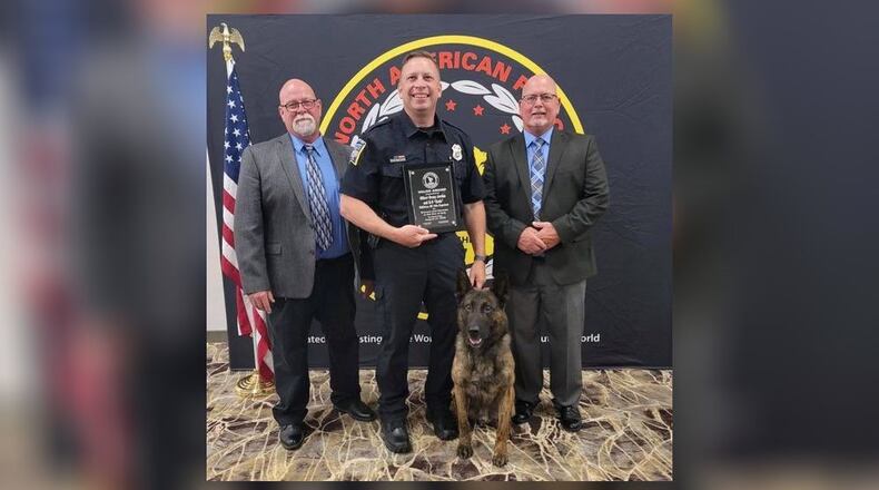Dennis "Denny" Jordan, a Middletown police officer, and his K-9, Koda, received the Valor Award Thursday night at the North American Police Work Dog Association (NAPWDA) Conference in Broken Arrow, Okla. SUBMITTED PHOTO