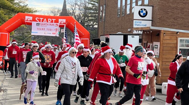 The Middletown Santa Run 1 Mile and 5k will be held at 9 a.m. Saturday. Santas will line up at Gravel Road Brewing Company, and jump on the bike path, looping back through downtown Middletown. Pictured is the Santa Run in 2023.
AMY BURZYNSKI/STAFF