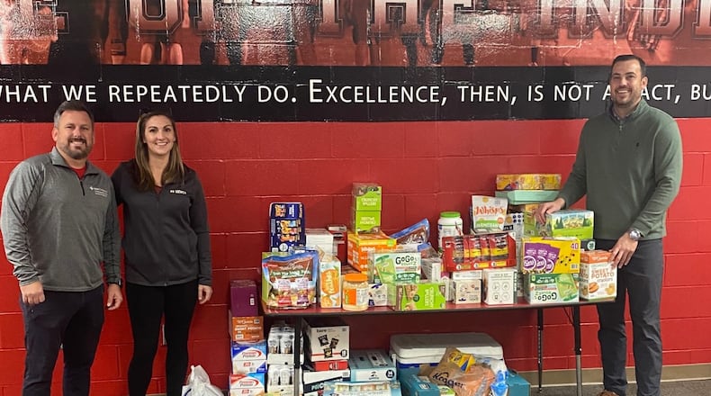 After hearing some Fairfield High School athletes were wolfing down unhealthy snacks before practicing, school officials scrambled together to create a first-of-its-kind organic and healthy snack pantry for team members. One of the district's new school athlete pantries' recent donation is pictured with Donation from HOIST Hydration: Mercy Health Athletic Trainer Brad Fraser, Rachel Trotta from HOIST Hydration, and Aaron Blankenship District Athletic Director. (Provided Photo\Journal-News)