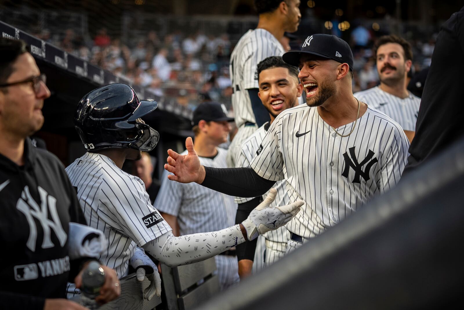 New York Yankees catcher J.C. Escarra (25) congratulates Jazz Chisholm Jr. (13) on his home run during the second inning of a baseball game against the Los Angeles Angels, Wednesday, June 18, 2025, in New York. (AP Photo/Angelina Katsanis)