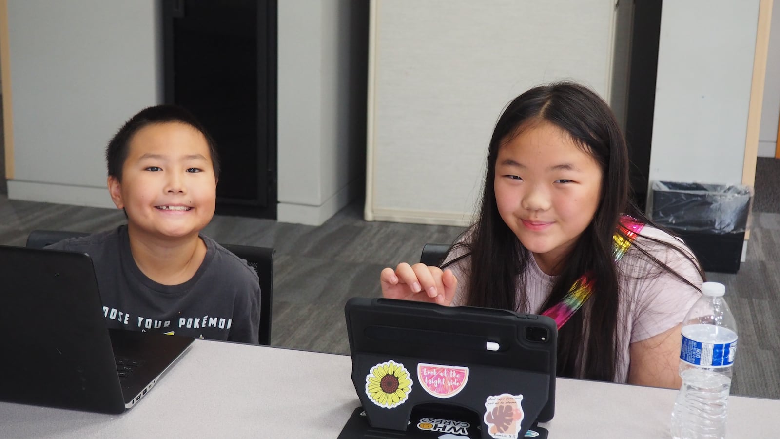 Alvin, 8 (pictured left) and Joyce, 9 (pictured right) take TechElevate's multi-week coding course for kids. BRYN DIPPOLD/STAFF