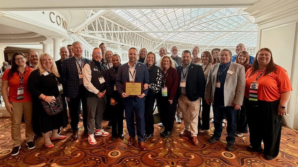 A veteran Butler Tech official is the first-time winner of a national honor for his work in career education. Butler Tech veteran Tony Huff, director of student services for the career school system, was recently announced as the national winner of the Association for Career and Technical Education (ACTE) CTE for All Division: Outstanding Contributions in CTE for All Award. Huff is pictured holding an Ohio award he won earlier this year joined by fellow Butler Tech officials. (Provided)