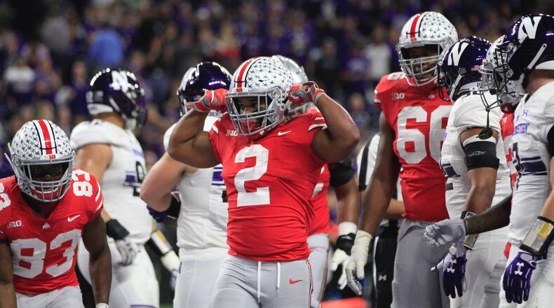 Ohio State’s J.K. Dobbins (2) celebrates after a touchdown run against Northwestern in the Big Ten Championship on Saturday, Dec. 2, 2018, at Lucas Oil Stadium in Indianapolis. David Jablonski/Staff