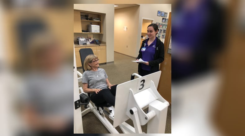 Physical therapist Julia Ward works with Sandy Stremel of Centerville. CONTRIBUTED