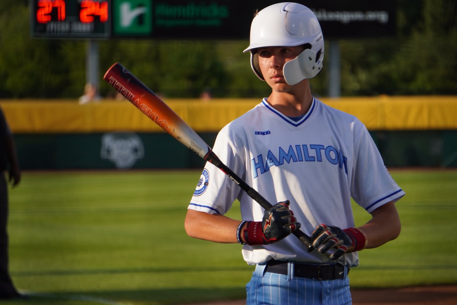 West Side Little League's Jonathan Lineback looks back towards the dugout before stepping up to the plate during his Great Lakes Region championship game against Clarendon Hills (Ill.) on Wednesday at the Little League Central Region Complex in Whitestown, Indiana. West Side lost 9-4. CHRIS VOGT / CONTRIBUTED
