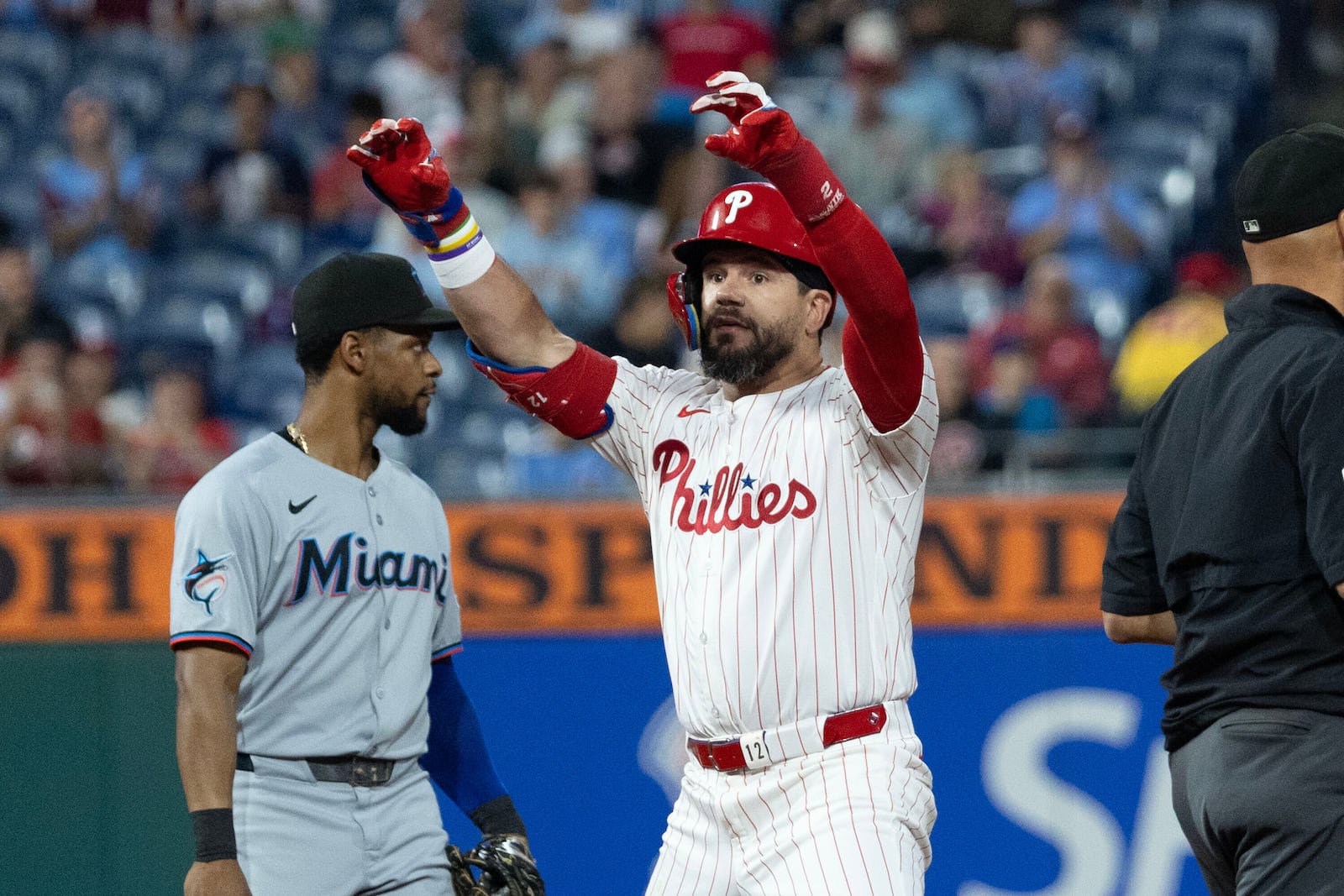 Philadelphia Phillies' Kyle Schwarber gestures from second base after hitting a double in the first inning of a baseball game against the Miami Marlins, Wednesday, Sept. 24, 2025, in Philadelphia. (AP Photo/Laurence Kesterson)