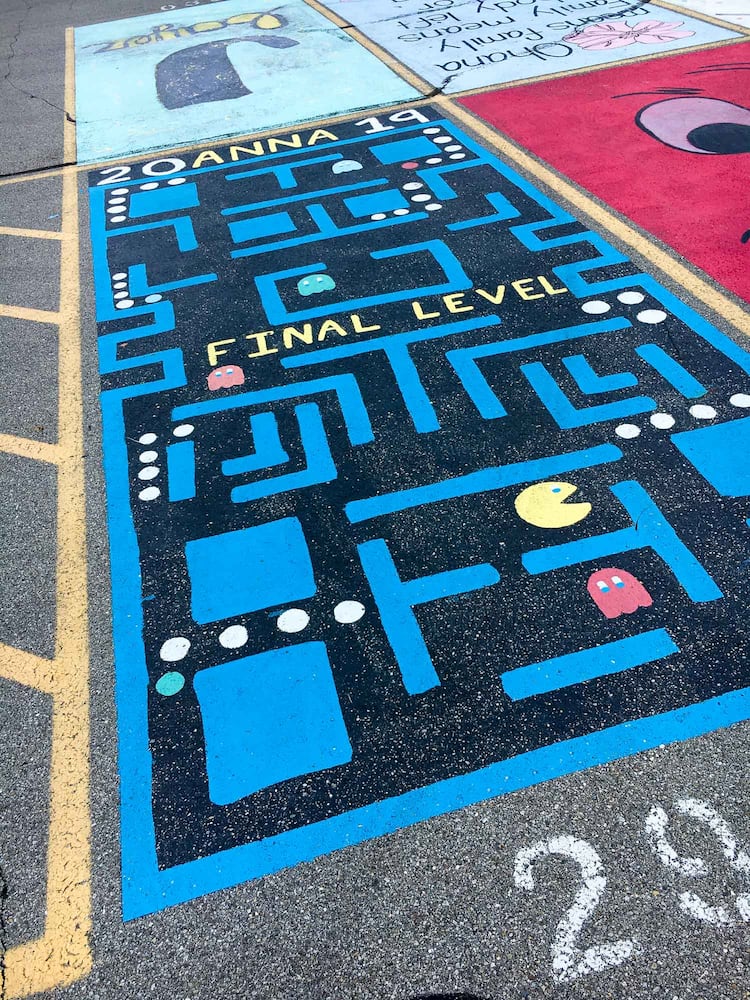 PHOTOS Lakota East seniors paint parking spots