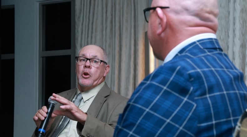 Larry King, left, who began his golf career as a caddie at Brown's Run Country Club, was inducted into the Southern Ohio PGA Hall of Fame Friday night at Scioto Reserve Country Club in Columbus. PGA member Pat Bernot emceed part of the ceremony. RON ALFREY/CONTRIBUTOR