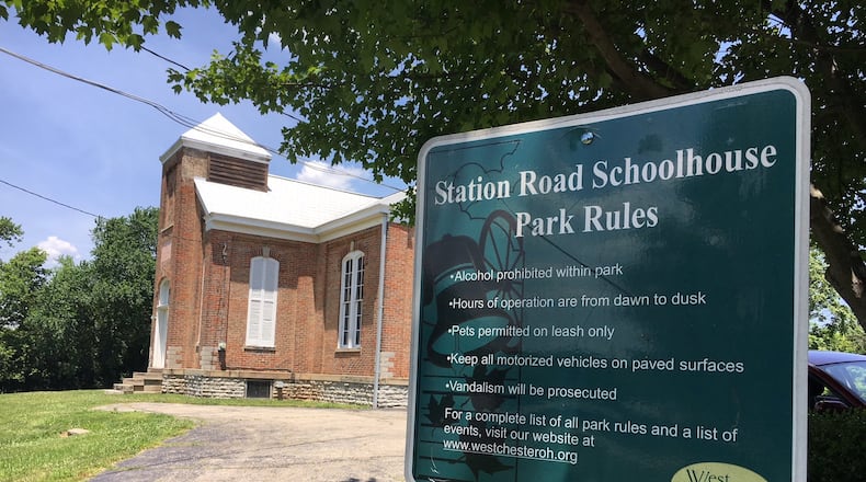 The historic Station Road schoolhouse in West Chester Twp. continues to be at the center of a battle between the owners of the Community Montessori School and neighbors who don’t want them to be able to buy the building from the township. FILE