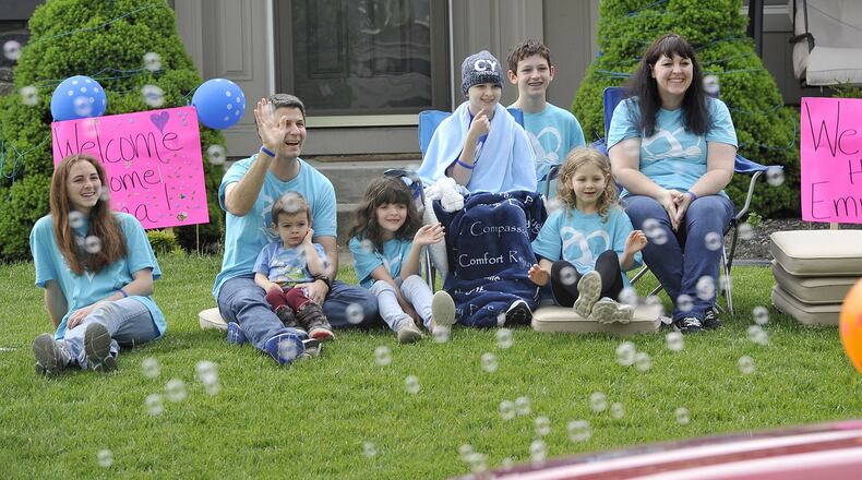 The community of Lebanon participated in a Welcome Home Parade for Emma Palmer Friday. Members of Emma s swim team, classmates, teachers, friends and family took part in the parade along with the police and fire departments. Emma collapsed on the pool deck during swim practice on Jan. 28, leaving her unconscious and unresponsive. She was life-flighted to the Children’s Hospital in Cincinnati for a spontaneous brain bleed. MARSHALL GORBYSTAFF