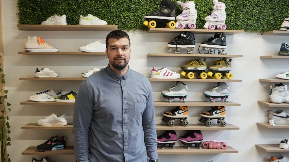 Mohamed Boukhatem, co-founder and director of SneakCoeurZ, a nonprofit organization giving used footwear a second life, poses in Champs-sur-Marne, east of Paris, Wednesday, March 25, 2026. (AP Photo/Thibault Camus)