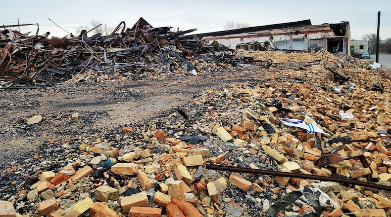 Debris remains Wednesday, Dec.. 30, 2020 nearly a year after the former Middletown Paperboard complex was destroyed by fire. Firefighters from multiple departments battled the fire that started on January 1, 2020. NICK GRAHAM / STAFF