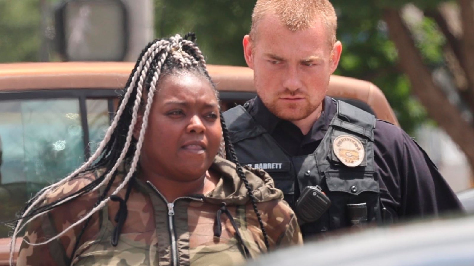 In this photo provided by WHAS-11 News, Breonna Taylor's aunt Bianca Austin is detained by police outside the federal courthouse where ex-Kentucky police officer Brett Hankison, convicted of using excessive force during the deadly Breonna Taylor raid, is taking place, Monday, July 21, 2025, in Louisville, Ky. (Alyssa Newton/WHAS-11 News via AP)