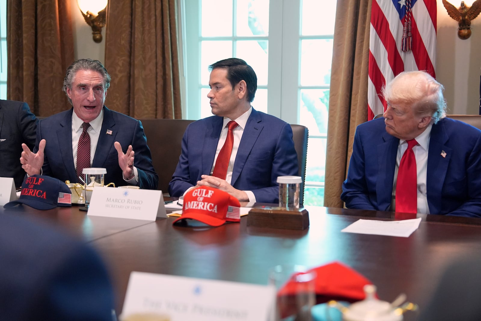 Interior Secretary Doug Burgum speaks during a cabinet meeting at the White House, Wednesday, April 30, 2025, in Washington, as Secretary of State Marco Rubio and President Donald Trump look on. (AP Photo/Evan Vucci)