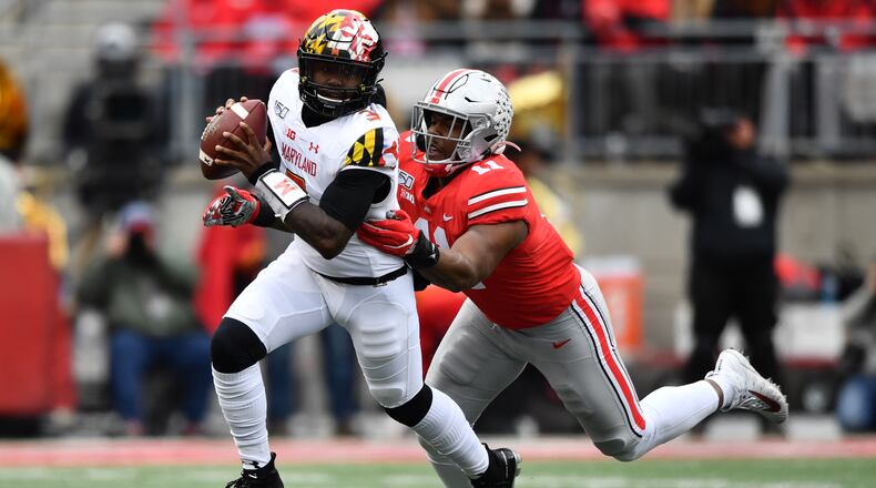 COLUMBUS, OH - NOVEMBER 9:  Tyreke Smith #11 of the Ohio State Buckeyes chases down quarterback Tyrrell Pigrome #3 of the Maryland Terrapins for a sack in the second quarter at Ohio Stadium on November 9, 2019 in Columbus, Ohio.  (Photo by Jamie Sabau/Getty Images)