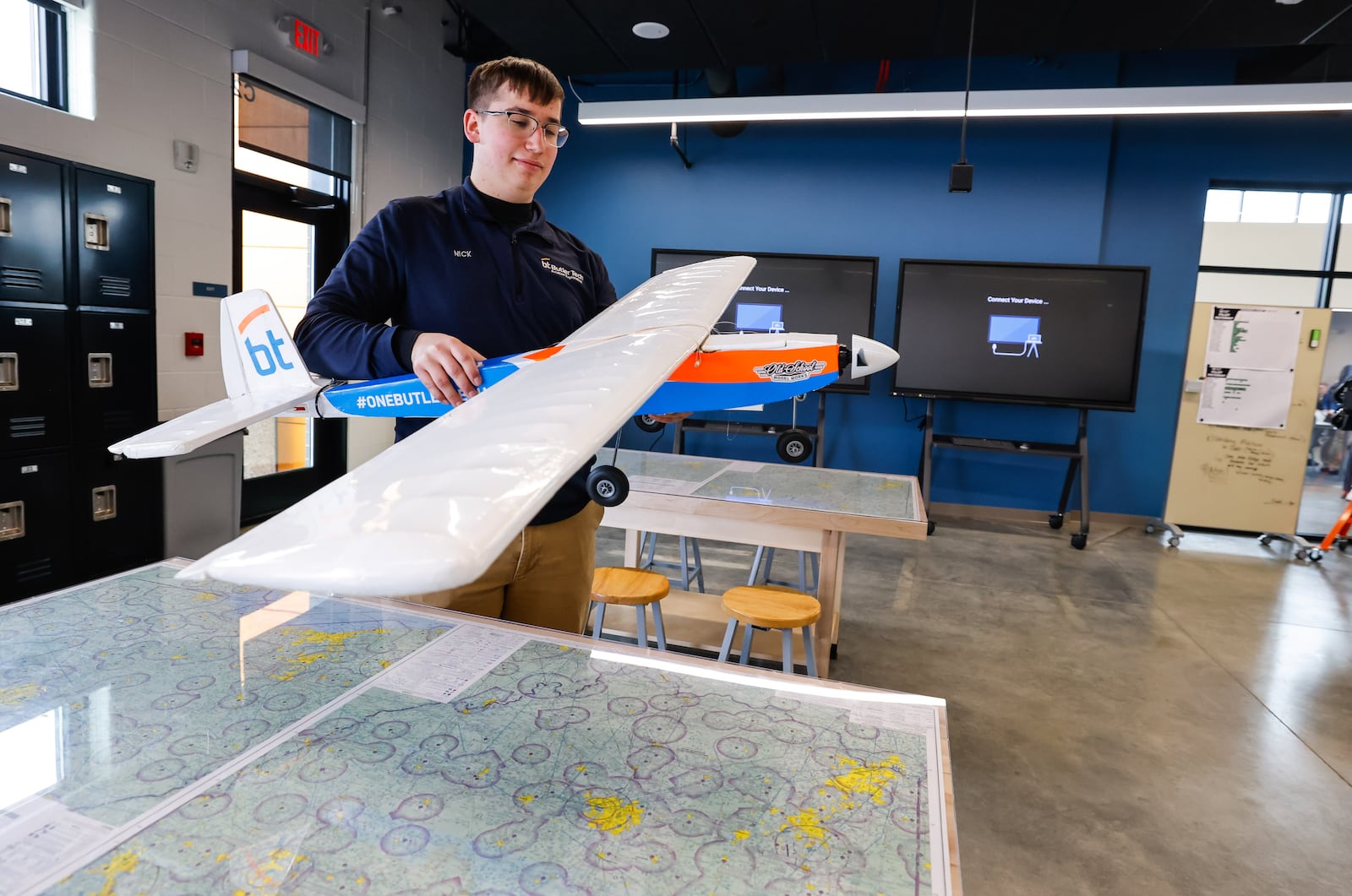 Senior Nick Guba stands in a classroom with model airplane after the ribbon cutting for Butler Tech's new Aviation Center Monday, March 16, 2026 at Middletown Regional Airport. NICK GRAHAM/STAFF