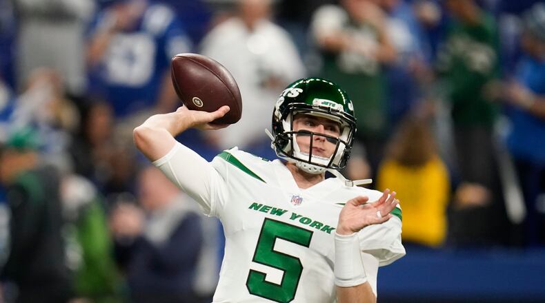 New York Jets quarterback Mike White (5) throws before an NFL football game between the New York Jets and Indianapolis Colts, Thursday, Nov. 4, 2021, in Indianapolis. (AP Photo/Michael Conroy)