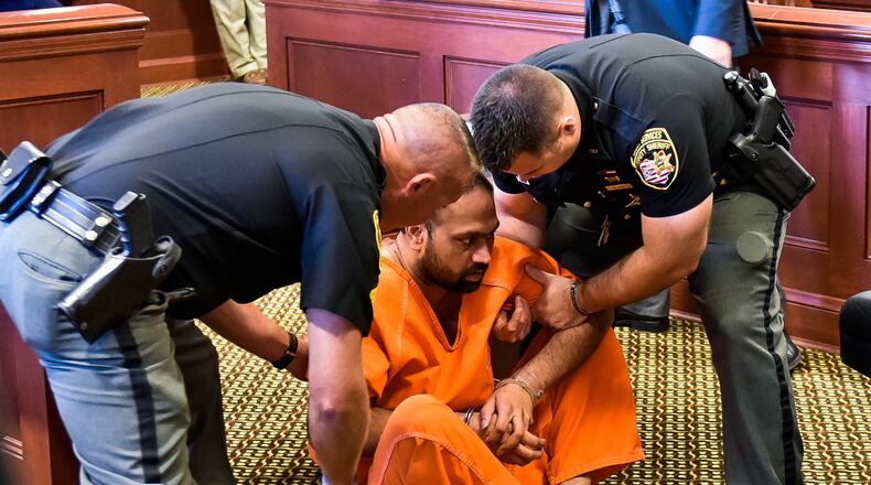 Gurpreet Singh, the West Chester man facing 4 counts of capital murder for the shooting death of 4 family members, was arraigned in Butler County Common Pleas Court Monday, August 5 in Hamilton. Singh fell to the ground while standing at the podium during the arraignment and was help up by Butler County Sheriff’s deputies. NICK GRAHAM/STAFF