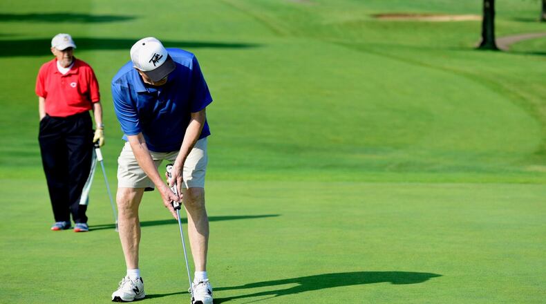 Joe Wermes putts Friday morning, May 26, on the green of hole 9 during a Senior Scramble at Twin Run in Hamilton. The city-owned golf course has seen “an uptick” in the number of tee times scheduled this season, likely due to the closure of Weatherwax Golf Course.