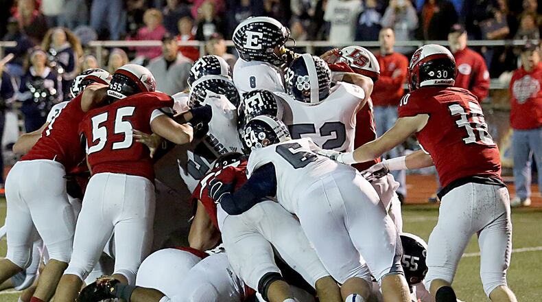 Edgewood quarterback Drew Reckart (8) rides the scrum into the end zone for a touchdown against La Salle during their Division II, Region 8 playoff game at Lancer Stadium in Cincinnati on Friday night. CONTRIBUTED PHOTO BY E.L. HUBBARD