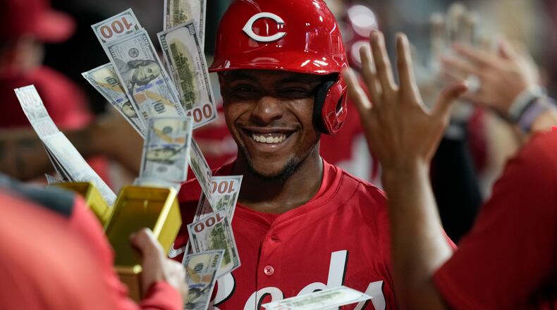 Cincinnati Reds' Ke'Bryan Hayes celebrates in the dugout after hitting a three-run homer during the eighth inning of a baseball game against the Atlanta Braves, Thursday, July 31, 2025, in Cincinnati. (AP Photo/Carolyn Kaster)