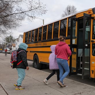 Ruskin Elementary School students board a bus on Friday, March 6 on McClure Street in Dayton. A bill in the Ohio House would provide $88 million for school transportation. BRYANT BILLING / STAFF