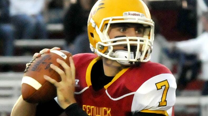 Fenwick quarterback Sam Simendinger looks to throw downfield during the first quarter of a Greater Catholic League Coed Division game against visiting Badin last Friday at Krusling Field. The host Falcons won 27-9. CONTRIBUTED PHOTO BY DAVID A. MOODIE