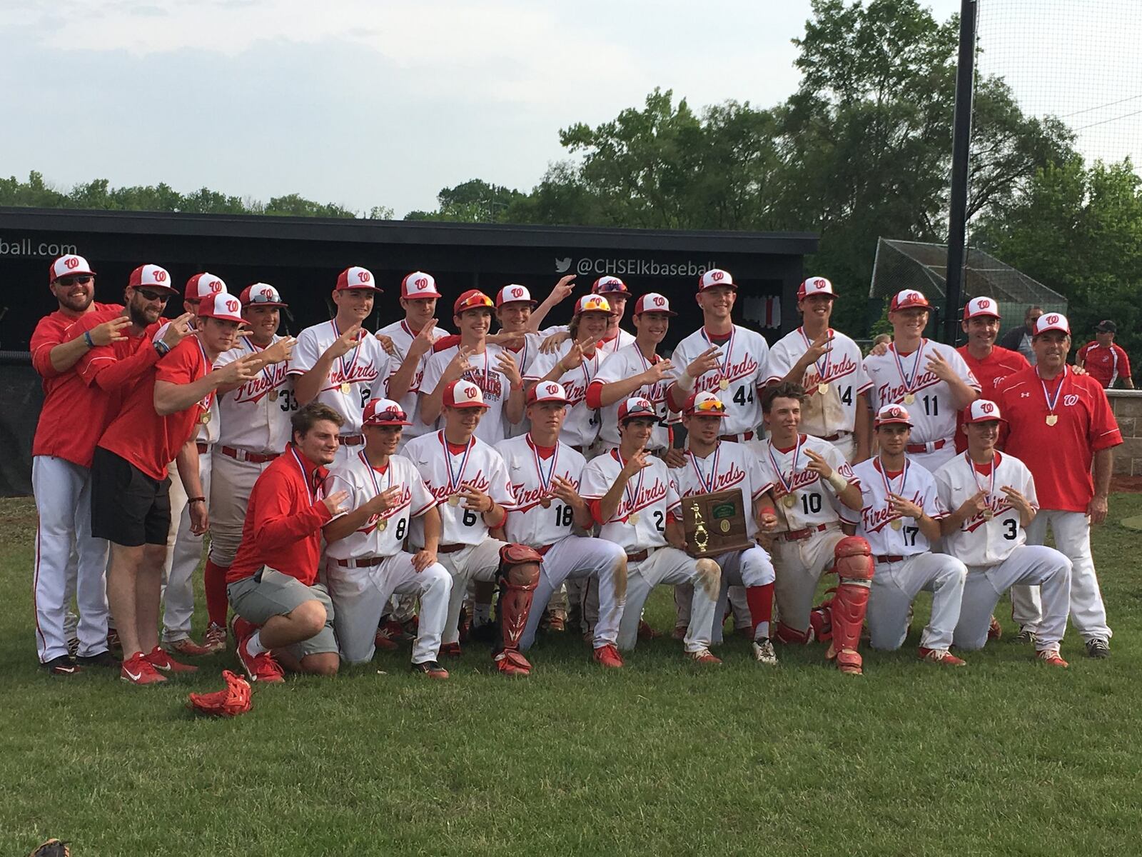 Lakota West’s players and coaches pose for a photo after beating Springboro 4-3 on Saturday in a Division I district final at Centerville. RICK CASSANO/STAFF