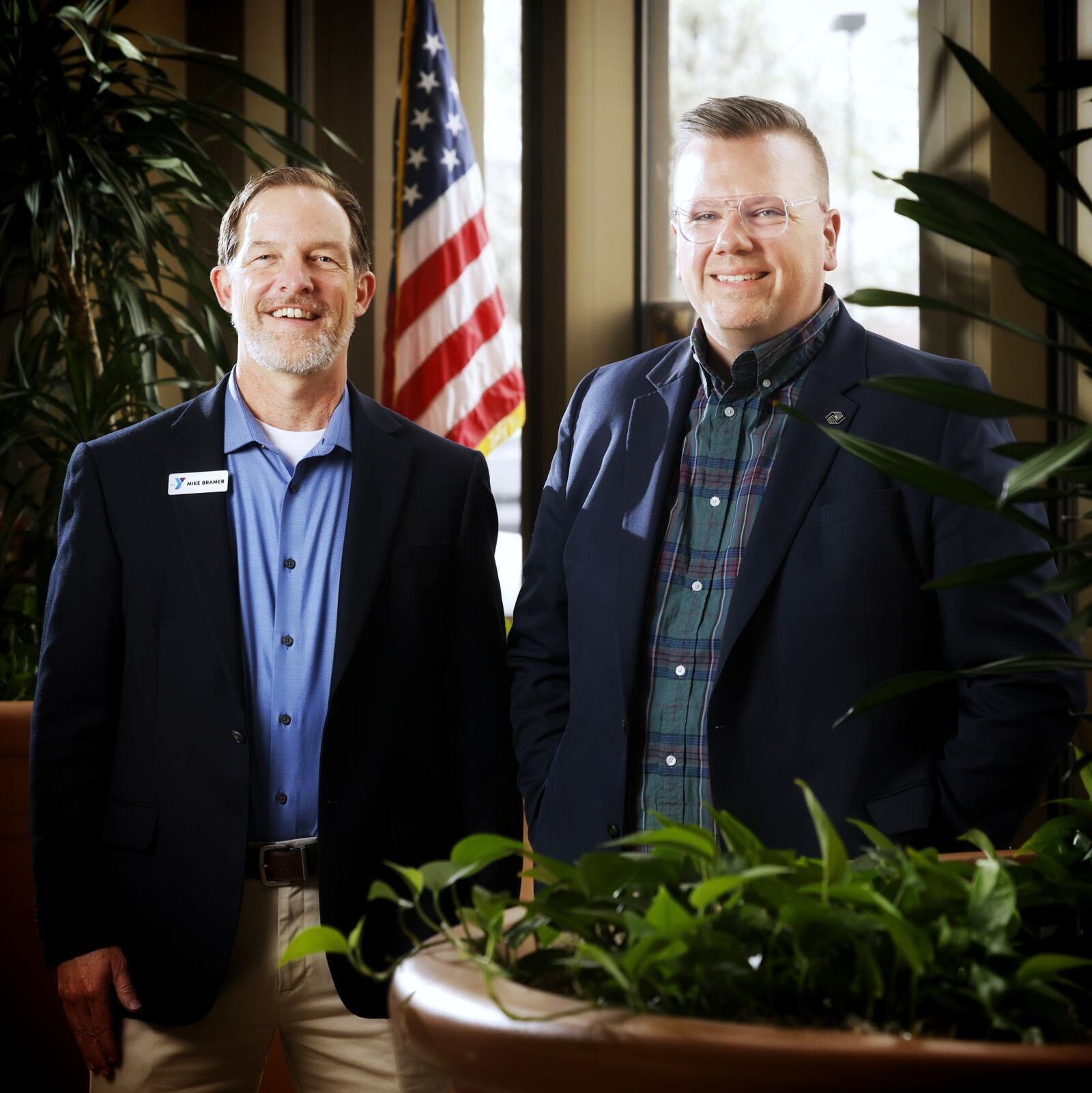 Great Miami YMCA CEO Mike Bramer, left, and Boys and Girls Clubs of Hamilton CEO Tommy John each were honored as CEO of the Year from their respective statewide associations, Ohio Area Council for Boys and Girls Club of America and Ohio Alliance of YMCAs. NICK GRAHAM/STAFF
