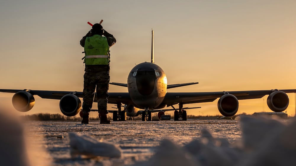 In this Jan. 28, 2026 photo, U.S. Air Force Master Sgt. Aaron Slupski, a crew chief with the 121st Maintenance Group, prepares to marshal a KC-135 Stratotanker at Rickenbacker Air National Guard Base, Columbus, Ohio. Ohio Gov. Mike DeWine said Friday that three of six crew members of an American KC-135 refueling plane were killed when it crashed in Iraq were from his state and had deployed with the Ohio Air National Guard's 121st Air Refueling Wing. (Ralph Branson, U.S. Air National Guard photo via AP)