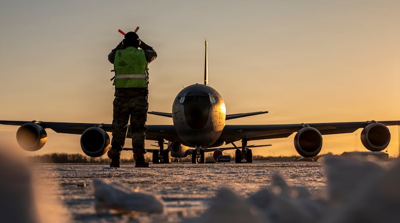 In this Jan. 28, 2026 photo, U.S. Air Force Master Sgt. Aaron Slupski, a crew chief with the 121st Maintenance Group, prepares to marshal a KC-135 Stratotanker at Rickenbacker Air National Guard Base, Columbus, Ohio. Ohio Gov. Mike DeWine said Friday that three of six crew members of an American KC-135 refueling plane were killed when it crashed in Iraq were from his state and had deployed with the Ohio Air National Guard's 121st Air Refueling Wing. (Ralph Branson, U.S. Air National Guard photo via AP)