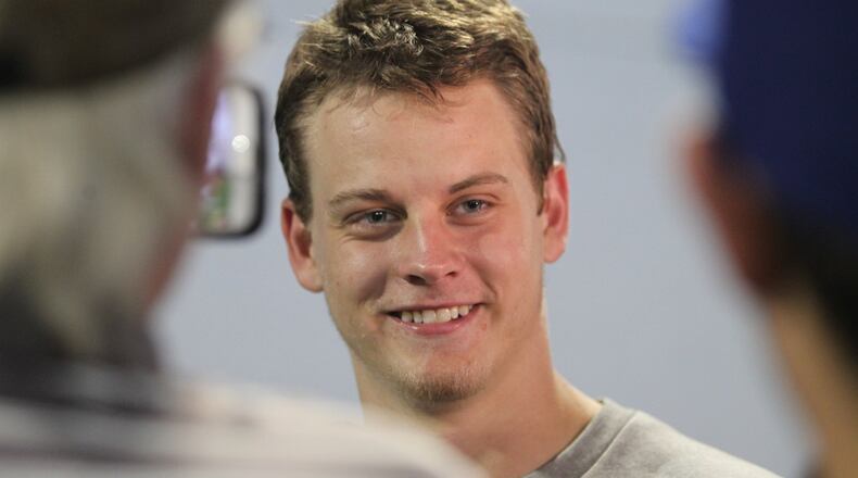 Ohio State quarterback Joe Burrow talks to reporters on Thursday, Aug. 11, 2016, at the Woody Hayes Athletic Center in Columbus. David Jablonski/Staff