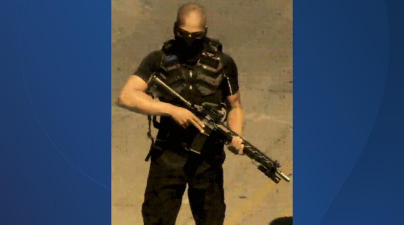 Federal prosecutors say West Chester resident John Johnson pointed his semi-automatic rifle at police during a 2020 protest in Louisville over the police killing of Breonna Taylor. CONTRIBUTED/FBI