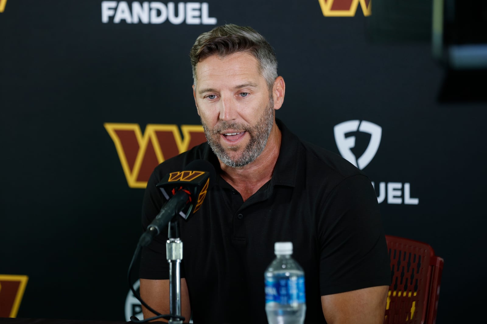 Washington Commanders general manager Adam Peters speaks during a news conference at the NFL football team's training camp in Ashburn, Va., Tuesday, July 22, 2025. (AP Photo/Luis M. Alvarez)