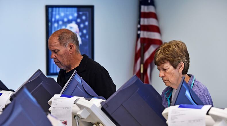 Voters cast ballots at Morgan Township Administration office during the primary election Tuesday, May 8 in Morgan Township. NICK GRAHAM/STAFF