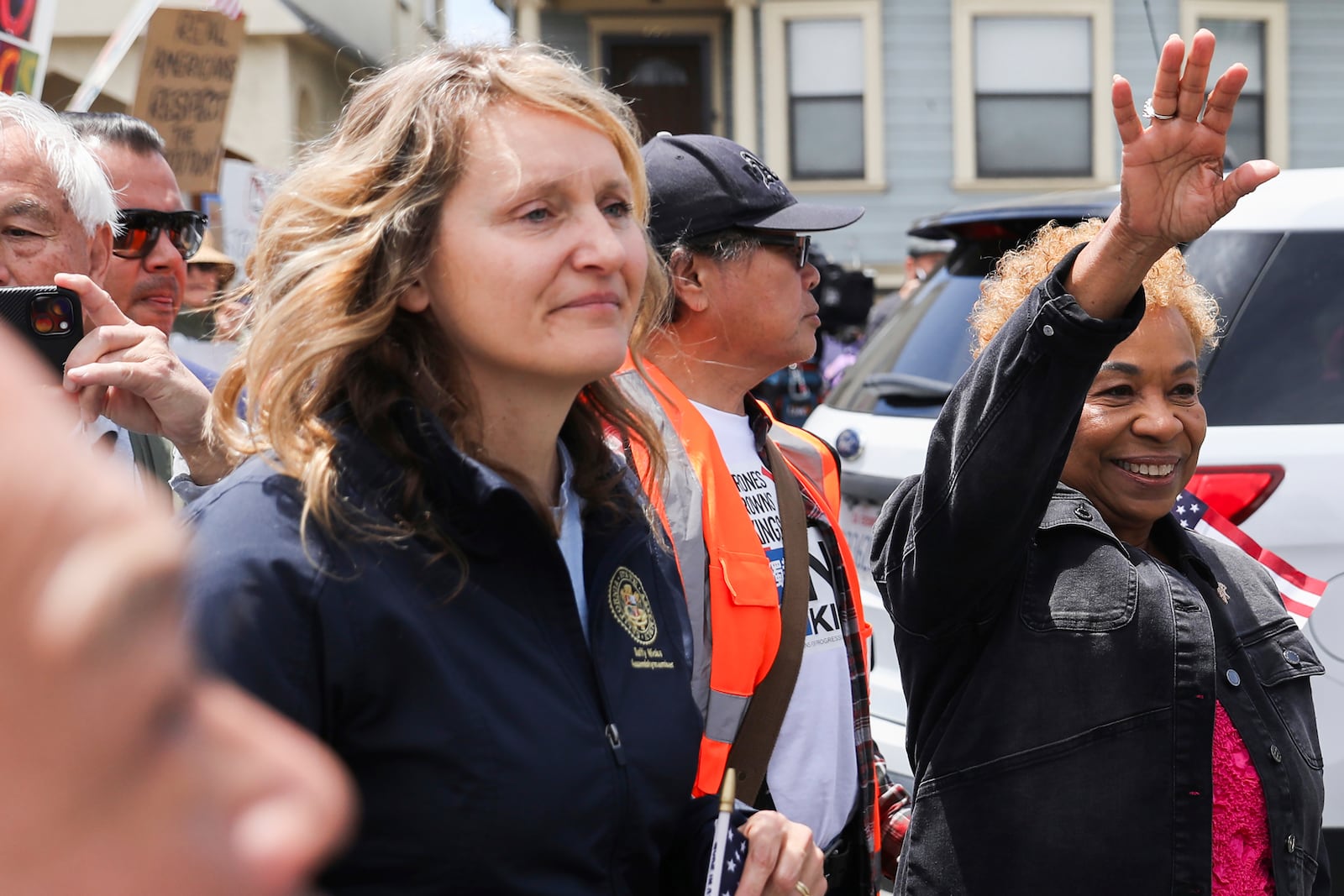 Assembly member Buffy Wicks, foreground, and Oakland Mayor Barbara Lee speak to the crowd at Wilma Chan Park before they march through downtown during a "No Kings” protest, Saturday, June 14, 2025, in Oakland, Calif. (Jessica Christian/San Francisco Chronicle via AP)