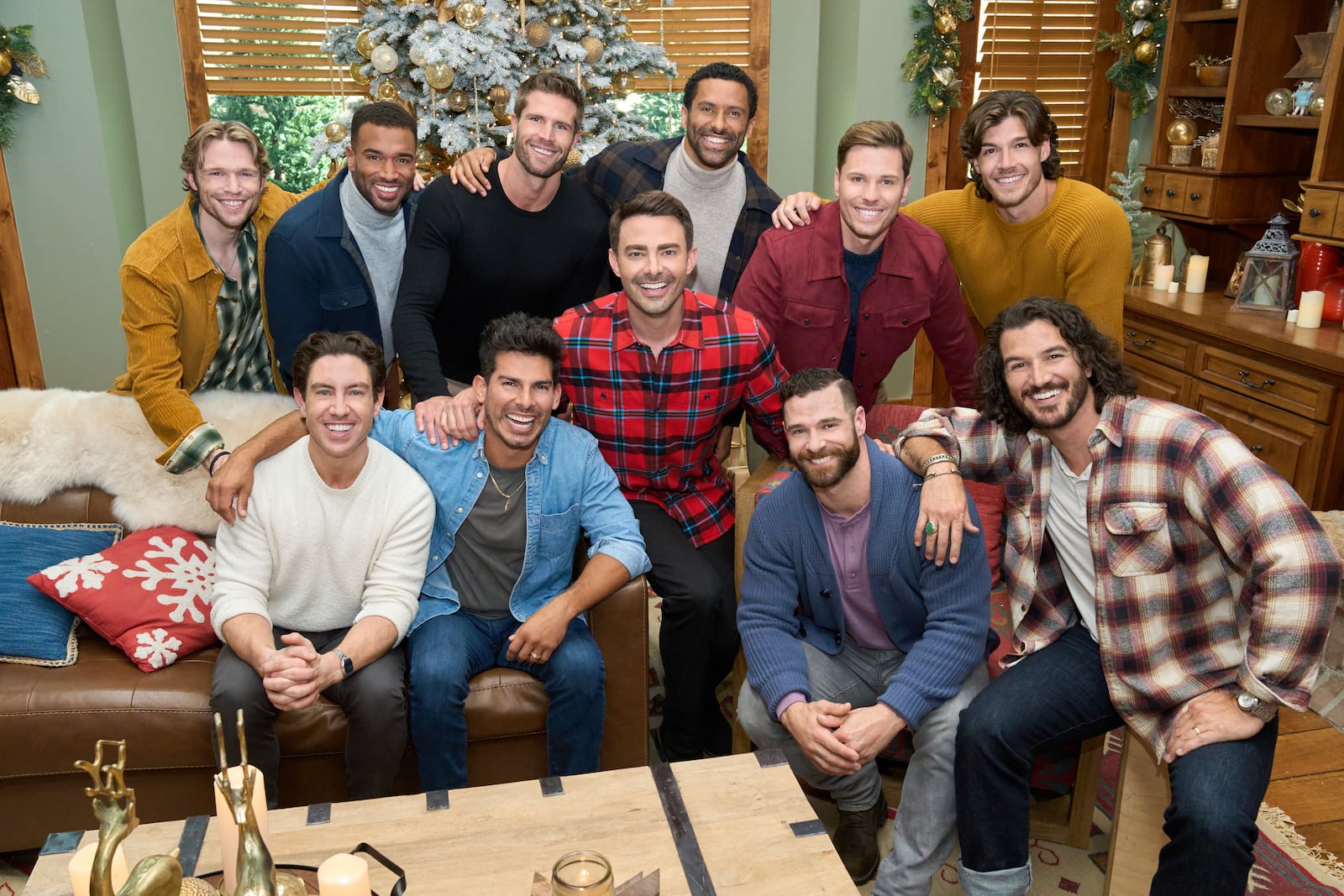Host Jonathan Bennett and judge Melissa Peterman kick off the hunt for Hallmark’s next leading man as 10 new hunks reinvent Santa, then brave a ski-slope meet-cute with Janel Parrish- where spills steal the scene. Photo: Logan Shephard (top row, far left), Robbie Simpson, Marcus Brodie, Angel Garet, Davey Fisher, Jonathan Bennett, Gabriel Thaxton, Jake Schum, Craig Geoghan, Drake Kuyper, Rustin Sailors Credit: ©2025 Hallmark Media/Photographer: Kim Nunneley