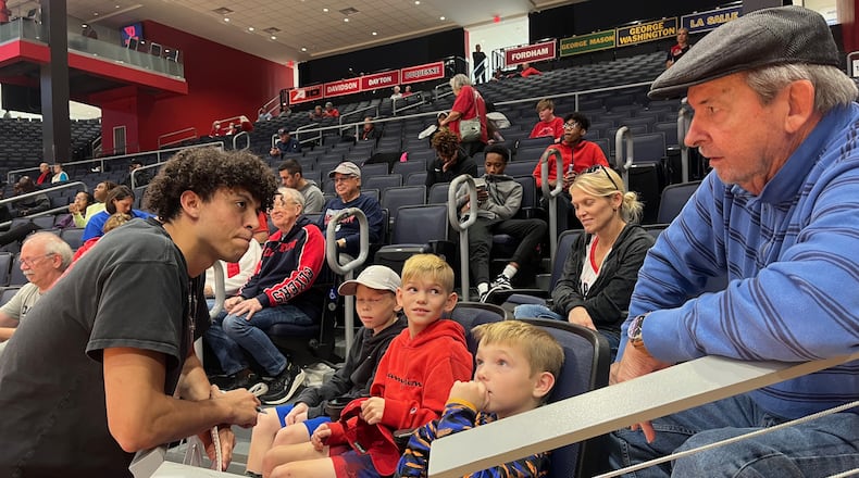Chaminade Julienne senior George Washington III, left, talks to fans at UD Arena during the Red & Blue Game on Oct. 15, 2022. David Jablonski/Staff