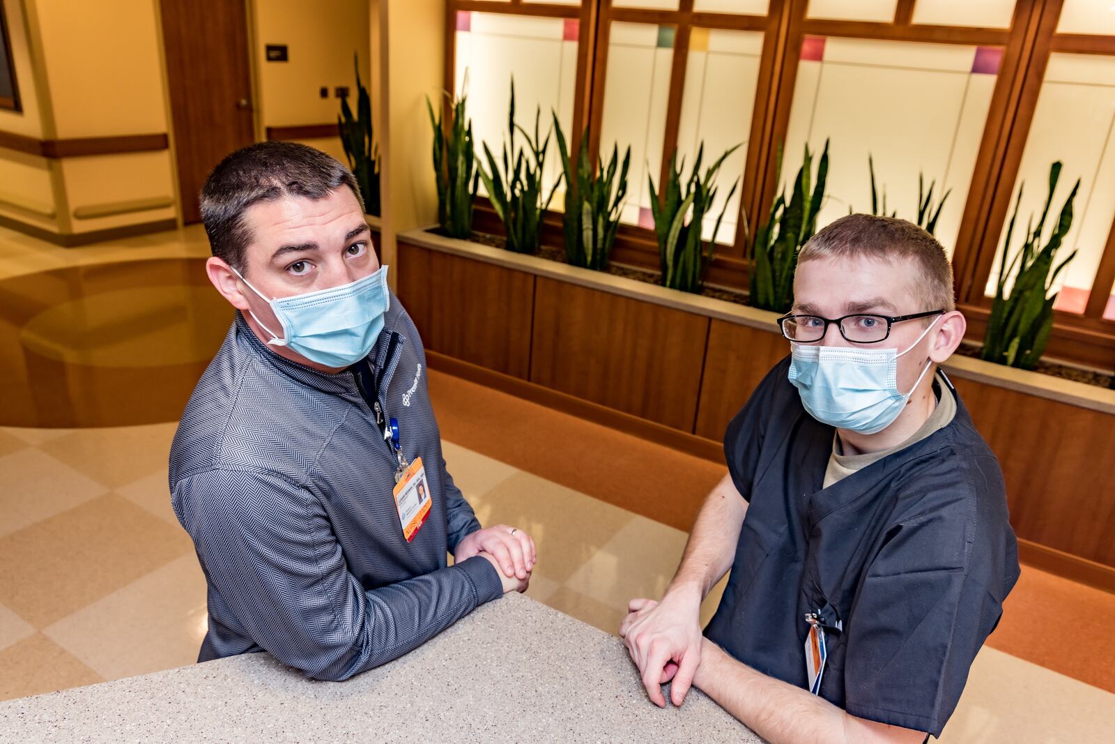 James "Logan" Beeman, left, a nurse manager at Atrium Medical Center, has been reunited with his brother-in-law, Brayden Hudnall, a specialist in the Ohio National Guard. Hudnall and other guardsmen were recently deployed to the Middletown hospital to assist in non-clinical duties due to COVID-19. Photo courtesy of Atrium Medical Center