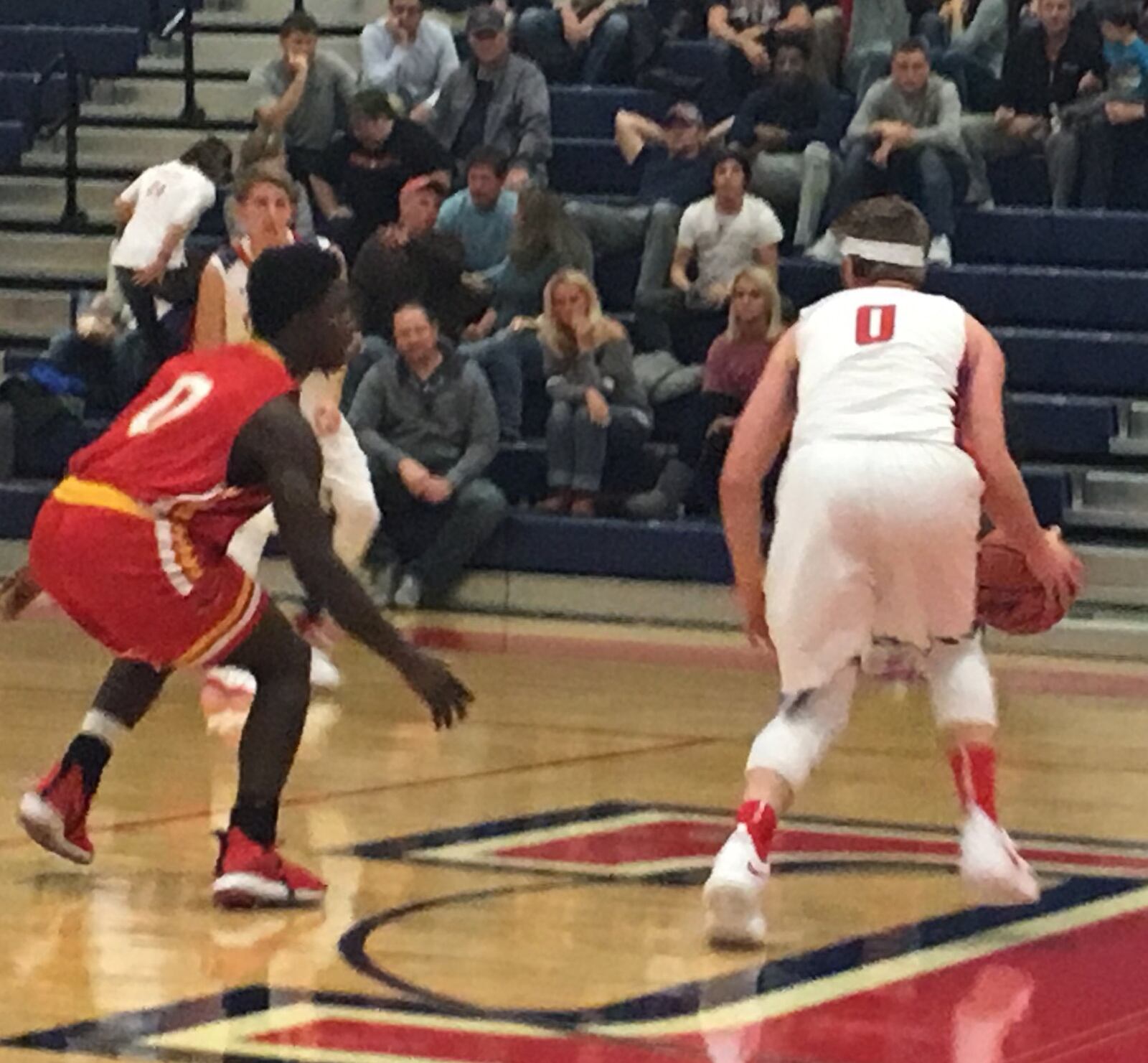 It’s 0 vs. 0 on Friday night in Oxford, with Fenwick’s Caleb Davis (left) guarding Talawanda’s Evan James. Davis had eight points in the Falcons’ 64-40 triumph. RICK CASSANO/STAFF