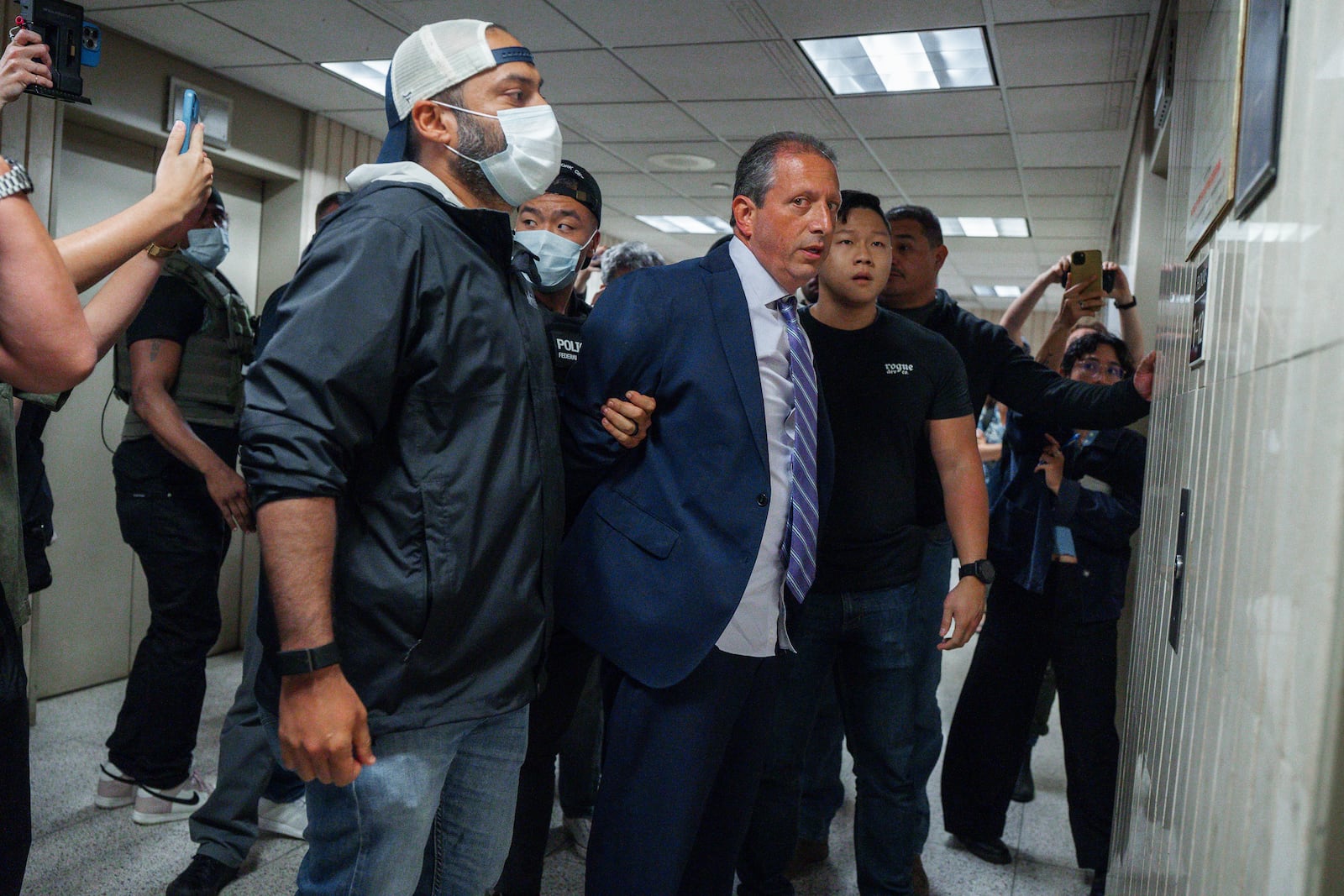 New York City Comptroller Brad Lander is placed under arrest by Immigration and Customs Enforcement (ICE) and FBI agents outside federal immigration court on Tuesday, June 17, 2025, in New York. (AP Photo/Olga Fedorova)
