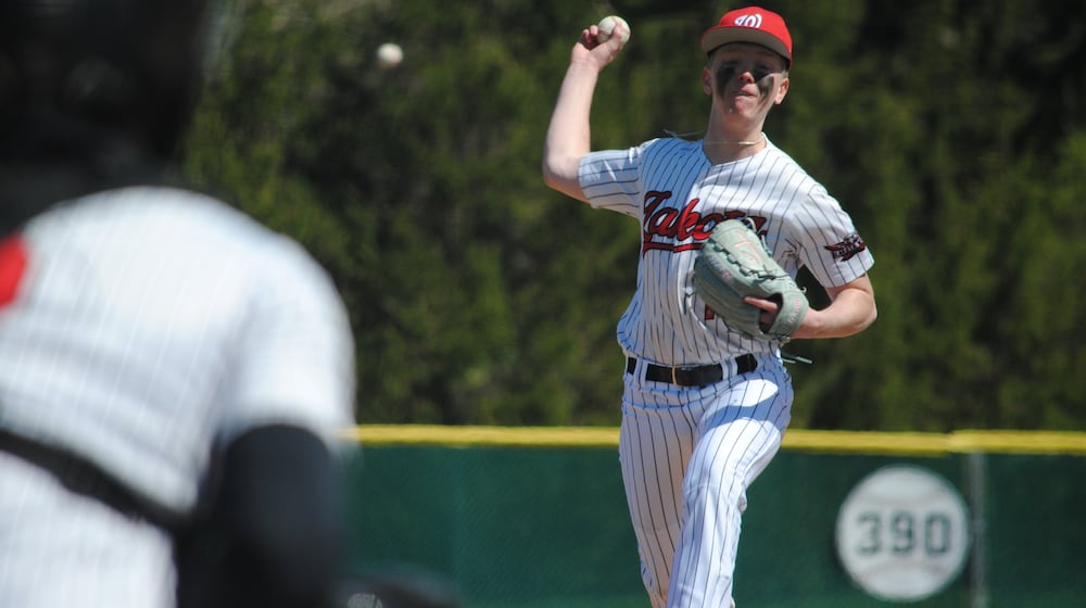 Lakota West's Caleb Binder sends a pitch to the plate against Milford on Saturday at Lakota West. CHRIS VOGT / CONTRIBUTED