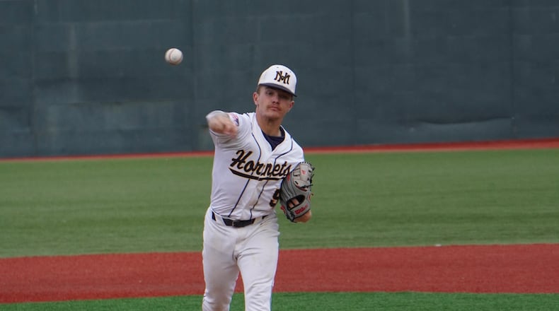 Monroe's Landen Wynn sends a pitch to the plate against Centerville on Friday night at Wright State. Chris Vogt/CONTRIBUTED