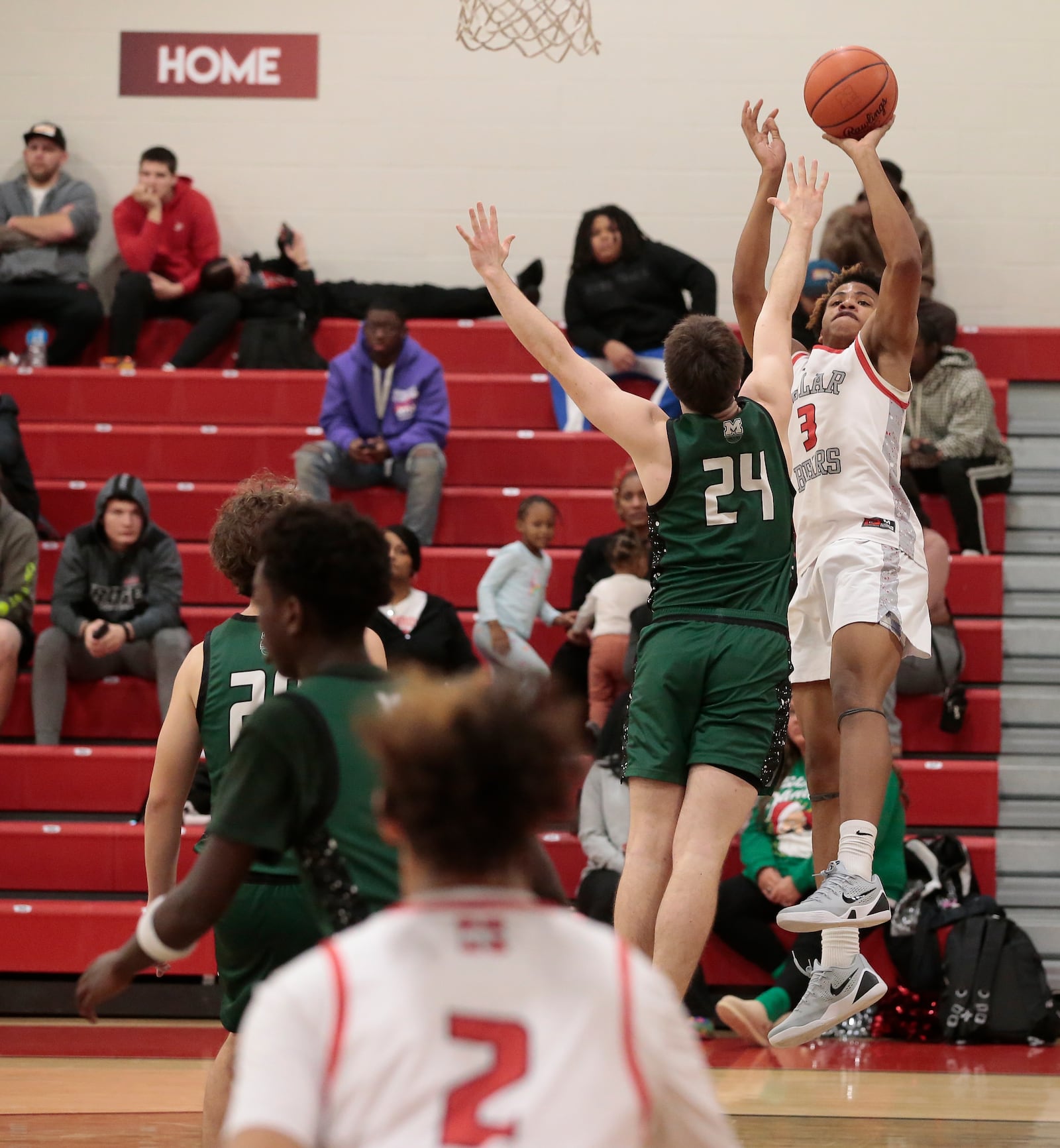 Northridge sophomore Keonte Smith fires a fadeaway shot over Mason  senior Wyatt Cooper. Northridge defeated Mason 52-43 in a non-league game Tuesday, Dec. 22, 2025, in Dayton. STEVEN WRIGHT / STAFF